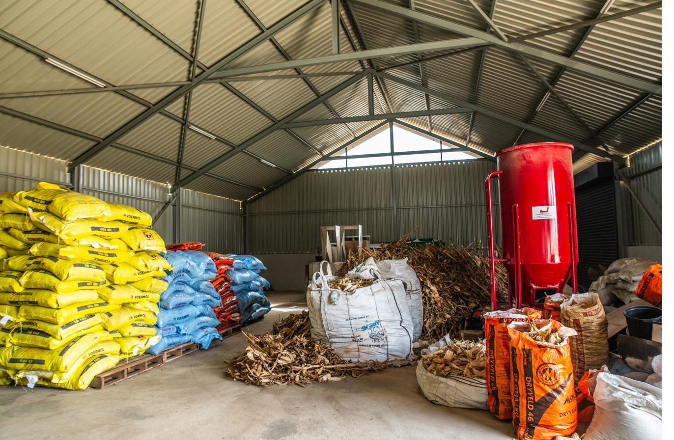 Tractor and feed equipment inside the DRM Livestock feed shed